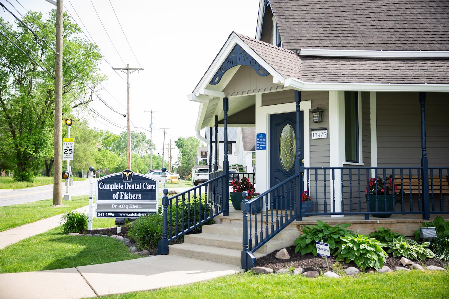 The image shows a small building with a sign that reads  Danville City Hall  next to a sidewalk, with a ramp leading up to an entrance door.